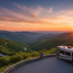 Sunset over Blue Ridge Parkway with winding road and RV, showcasing scenic beauty.