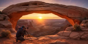 Sunrise over Mesa Arch, Canyonlands National Park, Utah with photographer