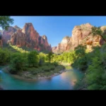 Panoramic view of a serene, untouched natural canyon with a river.